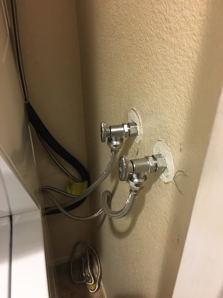 replaced hot and cold water valves in residential laundry room